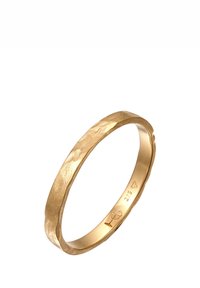 Guld-ring med en texturerad, vågig design. Slät insida med ingraverade mönster. Bandet har en något oregelbunden form och polerad yta.