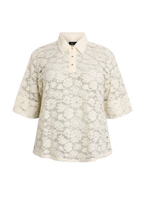 Krémová čipkovaná blúzka s krátkym rukávom, kvetinovým vzorom, špicatým golierom a zapínaním na gombíky vpredu.
