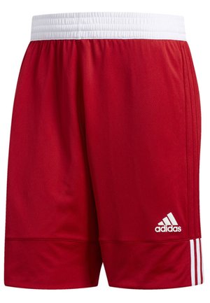 Pantaloni sportivi rossi realizzati in tessuto a rete, con una vita elastica bianca, tre strisce bianche sui lati e un logo Adidas all'orlo.