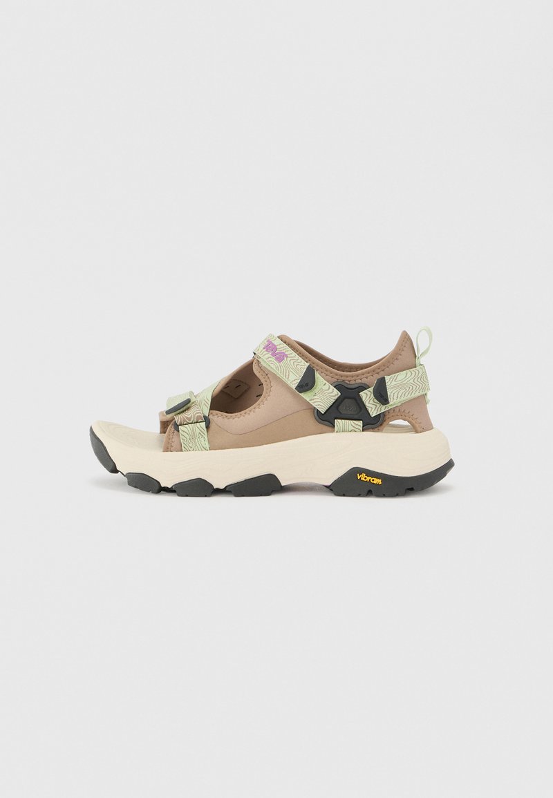 Beige and brown sporty sandals with patterned straps, adjustable closures, and a textured white sole featuring a black rubber outsole.