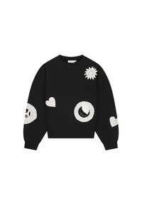 Zwarte sweatshirt met witte abstracte vlekken, waaronder harten, een zonnestraal, een cirkelpatroon en geribbelde manchetten en zoom.