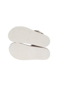 Fodtøj med gummisåler med et tekstureret grebmønster, brunt overmateriale og et simpelt design uden udsmykninger.