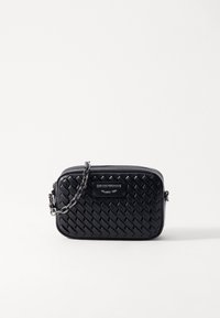 Black leather handbag with quilted pattern, silver chain strap, zip closure, and branded plaque featuring "Emporio Armani Milano 1981."