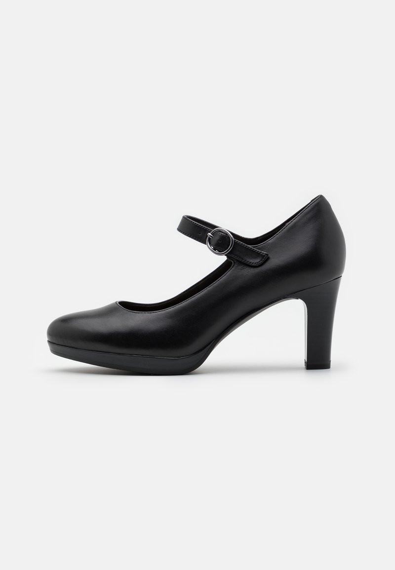 Escarpin Mary Jane en cuir noir avec bout arrondi, talon bloc de hauteur moyenne et bride réglable avec boucle argentée, présenté en vue de profil droit.