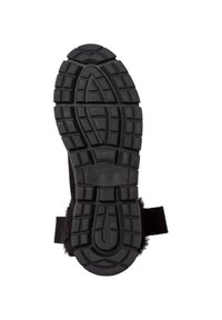 Suola di scarpa in gomma nera con un motivo testurizzato e robusto per una maggiore trazione. Include un tacco arrotondato e una cinghia laterale.