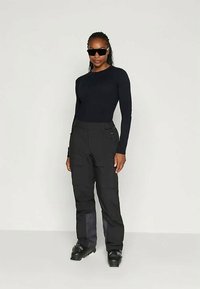 Helly Hansen SWITCH CARGO PANT - Ski pants - black