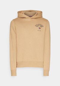Beżowa bluza z kapturem i sznurkiem, z prążkowanymi mankietami i dołem. Zawiera wyszywane "HILFIGER NEW YORK" w ciemnoniebieskim kolorze z detalem logo.