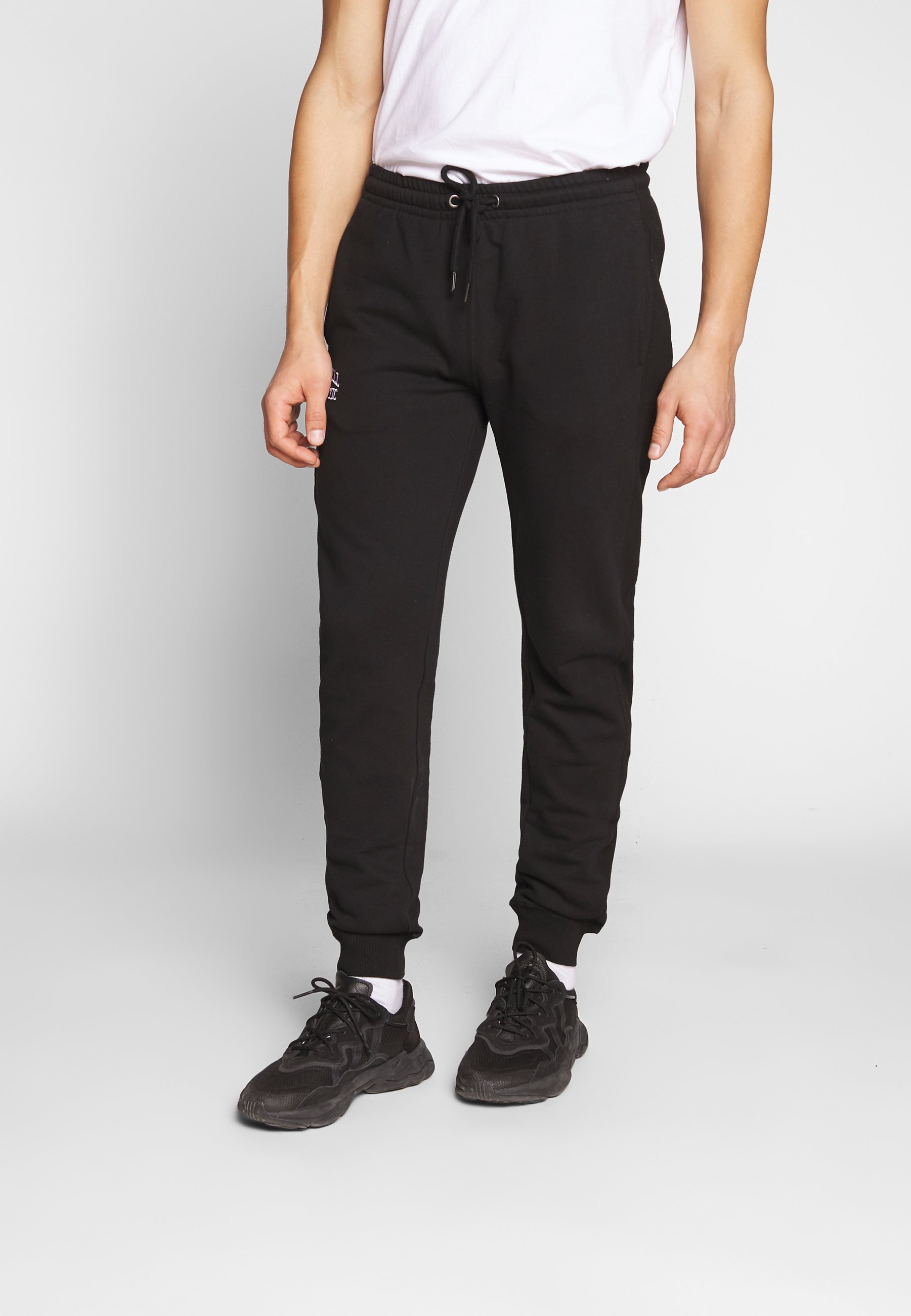 Russell Athletic Eagle R CUFFED LEG PANT SLIM FIT Russell Athletic Eagle R CUFFED LEG PANT SLIM FIT - Joggebukse - black