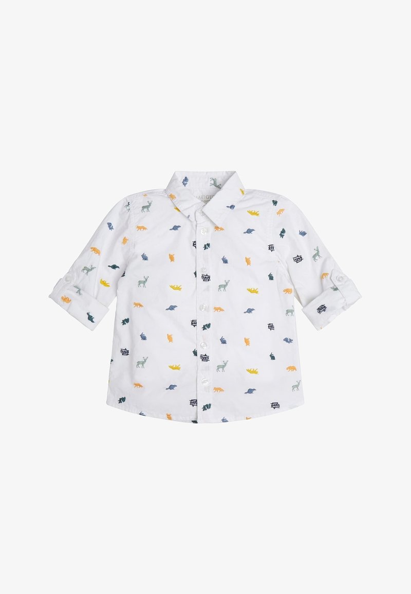 Chemise blanche à manches longues pour tout-petit avec des imprimés colorés d'animaux et de véhicules et des poignets boutonnés.