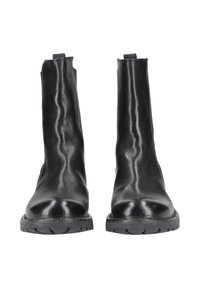 Black leather ankle boots with a smooth texture, elastic side panels, and lugged rubber soles for traction.