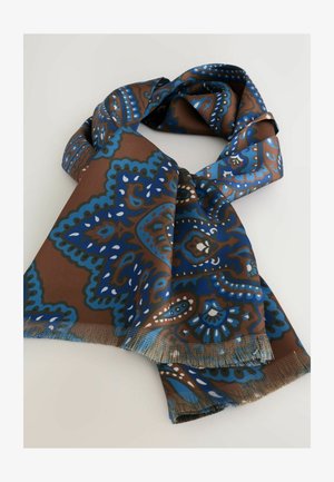 Ruskea huivi, jossa on sininen monimutkainen paisley-kuvio, sileä pinta ja tupsutetut reunat. Suunniteltu suorakaiteen muotoiseksi.