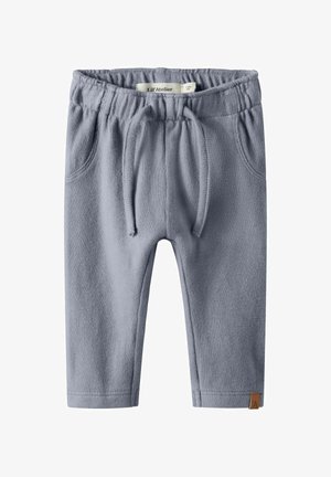 Pantalons pour tout-petits bleu clair en tissu doux et texturé. Dotés d'une taille élastique, d'un cordon de serrage et de deux poches avant.