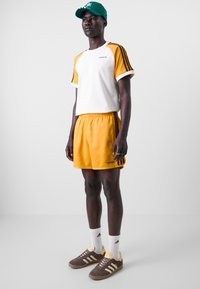 adidas Originals 80S SPRINT - Treniņtērpa apakšdaļas - orange