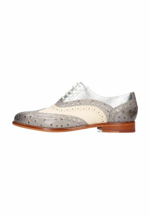 Gray and cream leather dress shoe with brogue detailing, silver accents, round toe, and a wooden heel. Features thin, flat laces.