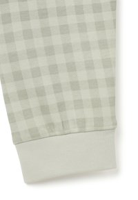 Light green checkered fabric featuring a soft texture. Includes a ribbed cuff at the hem for a snug fit.
