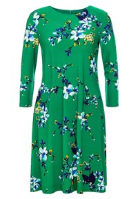 Zelené květinové šaty s dlouhými rukávy, kulatým výstřihem a áčkovým střihem. Obsahují bílé květy, modré akcenty a žluté detaily na hladkém materiálu.