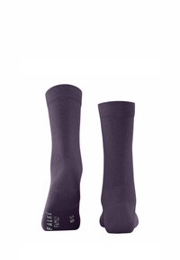 Chaussettes en coton violettes avec des bordures côtelées ; logo imprimé sur le côté. Texture lisse et design mi-mollet.