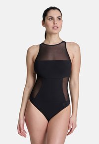 Maillot de bain noir à une pièce avec une partie supérieure en maille, un col montant et des panneaux solides contrastants au niveau du torse et des hanches. Texture lisse sur l'ensemble.