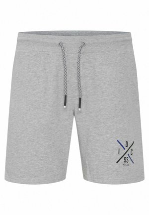 Grå bomullsshortser med elastisk midje og snor. Har et blått og svart grafisk design på venstre ben.