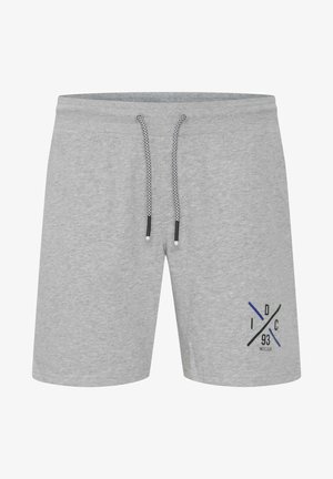 Grå bomullsshortser med elastisk midje og snor. Har et blått og svart grafisk design på venstre ben.