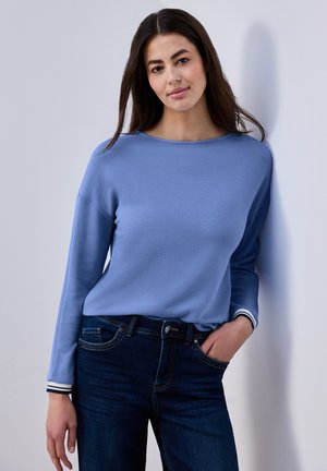 - Bluzka z długim rękawem