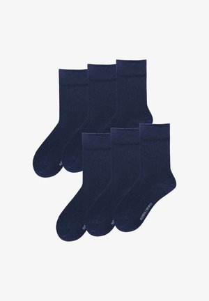 Navy blue socks, cotton blend, mid-calf length, ribbed cuffs, smooth texture, six pairs arranged, featuring subtle branding on the sole.