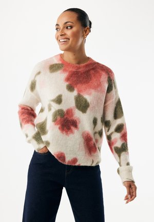 Trui met bloemenpatroon in zacht, pluizig materiaal, met tinten roze en groen op een crèmekleurige achtergrond. Ronde halslijn met geribbelde manchetten.