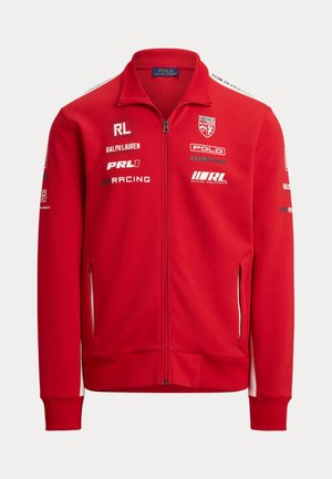 Rode zip-up jack met hoge kraag. Gemaakt van zachte stof, voorzien van witte accenten, meerdere logo's en zijzakken met ritsen.
