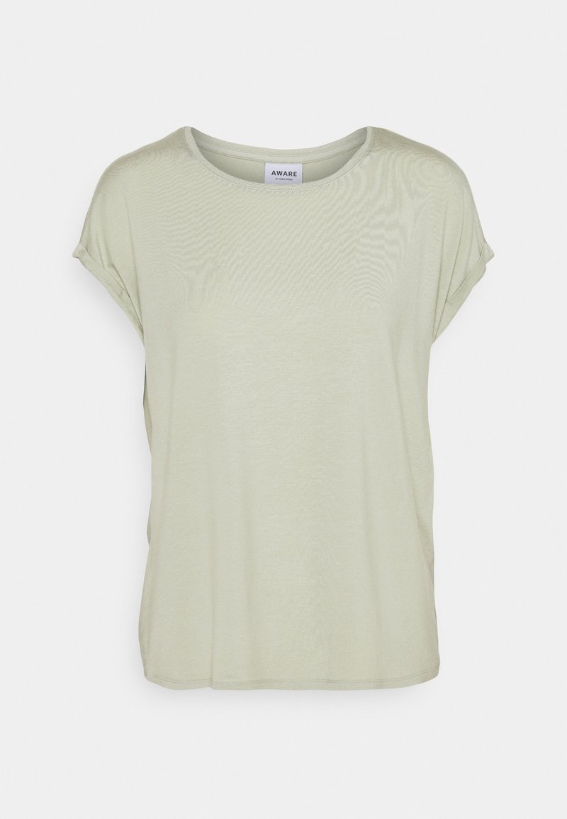 T-shirt vert clair à manches courtes avec un col rond, texture douce, coupe ample et design de manches retroussées. L'étiquette indique "AWARE" à l'intérieur du col.