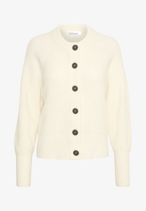 Fehér kötött kardigán, kerek nyakkal, hét nagy sötét gombbal és bordázott textúrával. Hosszú ujjú, szűkített mandzsettával.