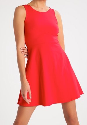 Red sleeveless dress with a fitted bodice and flared skirt. Smooth fabric, knee-length, round neckline, and no visible patterns or accents.
