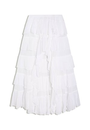 Jupe blanche à volants superposés avec plusieurs couches et une ceinture élastique, créant une apparence fluide et légère.
