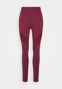 Leggings de cintura alta en un color burdeos profundo, con una textura suave y paneles en contraste con un diseño geométrico a lo largo de los lados.