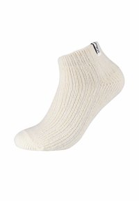 Calzino alla caviglia color crema con una texture a coste, dotato di un discreto etichetta logo sul retro. Design corto e leggero adatto per il clima caldo.