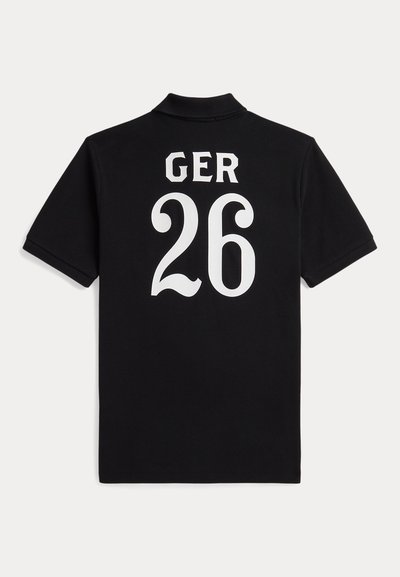 Черна поло тениска с къс ръкав с бял текст "GER" и номер "26" на гърба.
