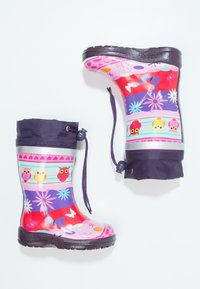 Bottes de pluie en caoutchouc colorées avec des motifs de hibou, des motifs violets et roses, et un haut en noir. Elles possèdent une semelle texturée pour une meilleure adhérence.