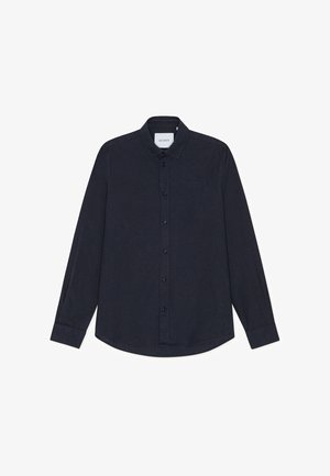 Tume sinine pikkade varrukatega puuvillast särk, millel on nööpidega krae, esikäe nööpide rida ja väike logo rinnal.