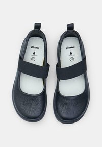 Czarne skórzane buty typu Mary Jane z szerokim elastycznym paskiem, okrągłym noskiem i wyściełaną wkładką. Rozmiar 32 nadrukowany na wkładce.