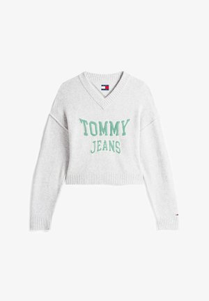 Pull cropped gris avec décolleté en V, ornée d'une broderie verte "TOMMY JEANS". Manches et bas côtelés, fabriqué en tissu doux.