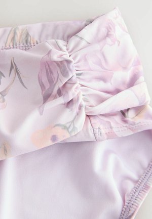 Floral-patterned lilac swimsuit with a ruched bow detail at the waist. Smooth texture with a stretchy, lightweight fabric.