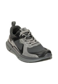 Men's athletic shoe in black and gray, featuring mesh and suede material, padded collar, lace-up design, and textured rubber sole.