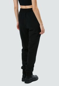 INFLUENCER LOGO EMBROIDERED - Jogginghose - black