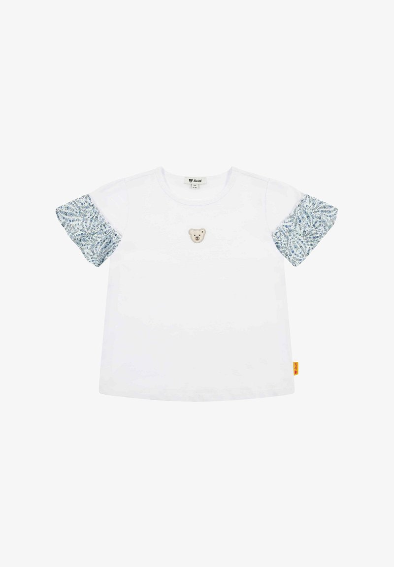 Bílé tričko s krátkým rukávem a vzorovanými modrými rukávy, s výšivkou medvěda na přední straně. Měkký bavlněný materiál, volný střih, žebrovaný výstřih.