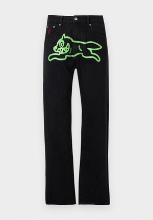 Sorte jeans med rett snitt, med et stort grønt grafisk motiv av en løpende tegneserie-katt på baksiden. Sølvfarget maskinvare som detaljer.