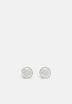 Round stud earrings made of metal with clear, faceted glass stones, featuring a scalloped edge design for added detail.