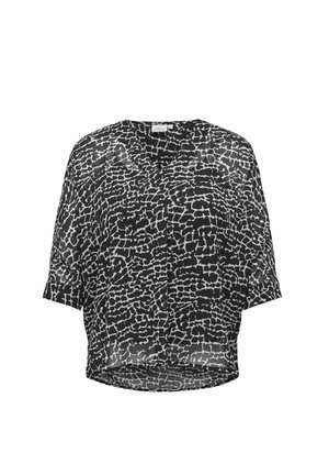 Blusa trasparente bianca e nera con vestibilità rilassata, caratterizzata da un design in stampa animale testurizzata e maniche corte. Orlo arrotondato nella parte inferiore.