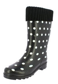 Black rubber rain boot with white polka dots, ribbed black upper cuff, slightly curved shape, textured sole for traction.