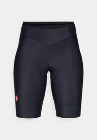 Sorte sykkelshorts laget av elastisk, glatt materiale. Har en polstret chamoisinnsats og en liten merket logo på venstre ben.