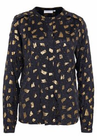Blusa nera a maniche lunghe con design astratto dorato, tessuto lavorato, chiusura frontale con bottoni e colletto. Sottotoni a pois.