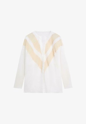 Weiße langärmelige Jacke mit beigen Chevron-strukturierten Streifen über den Schultern und dem oberen Brustbereich, offenes Frontdesign.